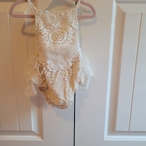 Boho crochet ruffle onsie fits a 12-18 month size.